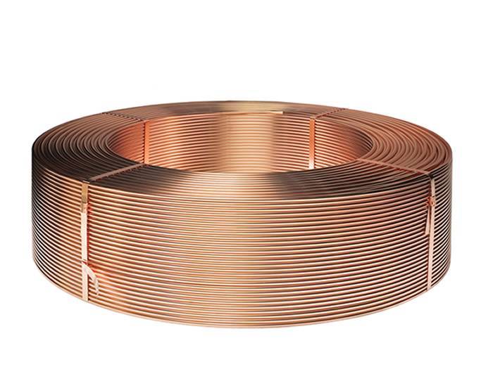 A coil of copper wire on the white background.
