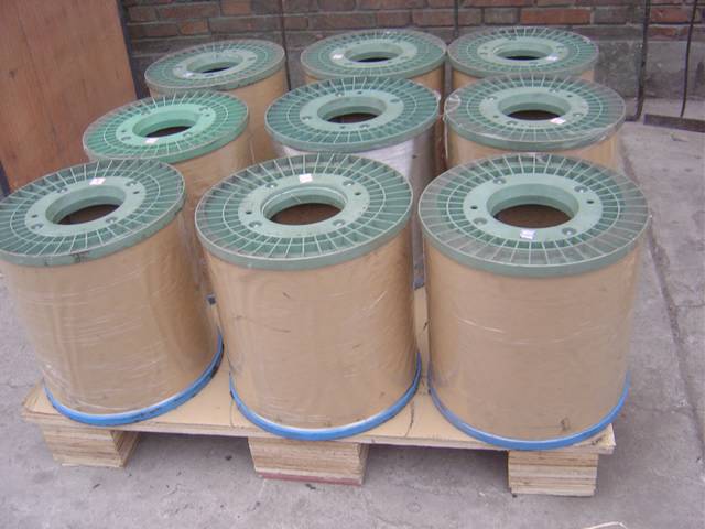 Nine coil of copper steel wire with axles in waterproof paper and pallet package.