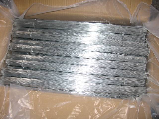 Several bundles of galvanized steel wire with plastic film in a cartons.
