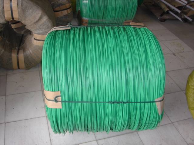 A big coil of light green PVC coated wire is packed with packing strap.